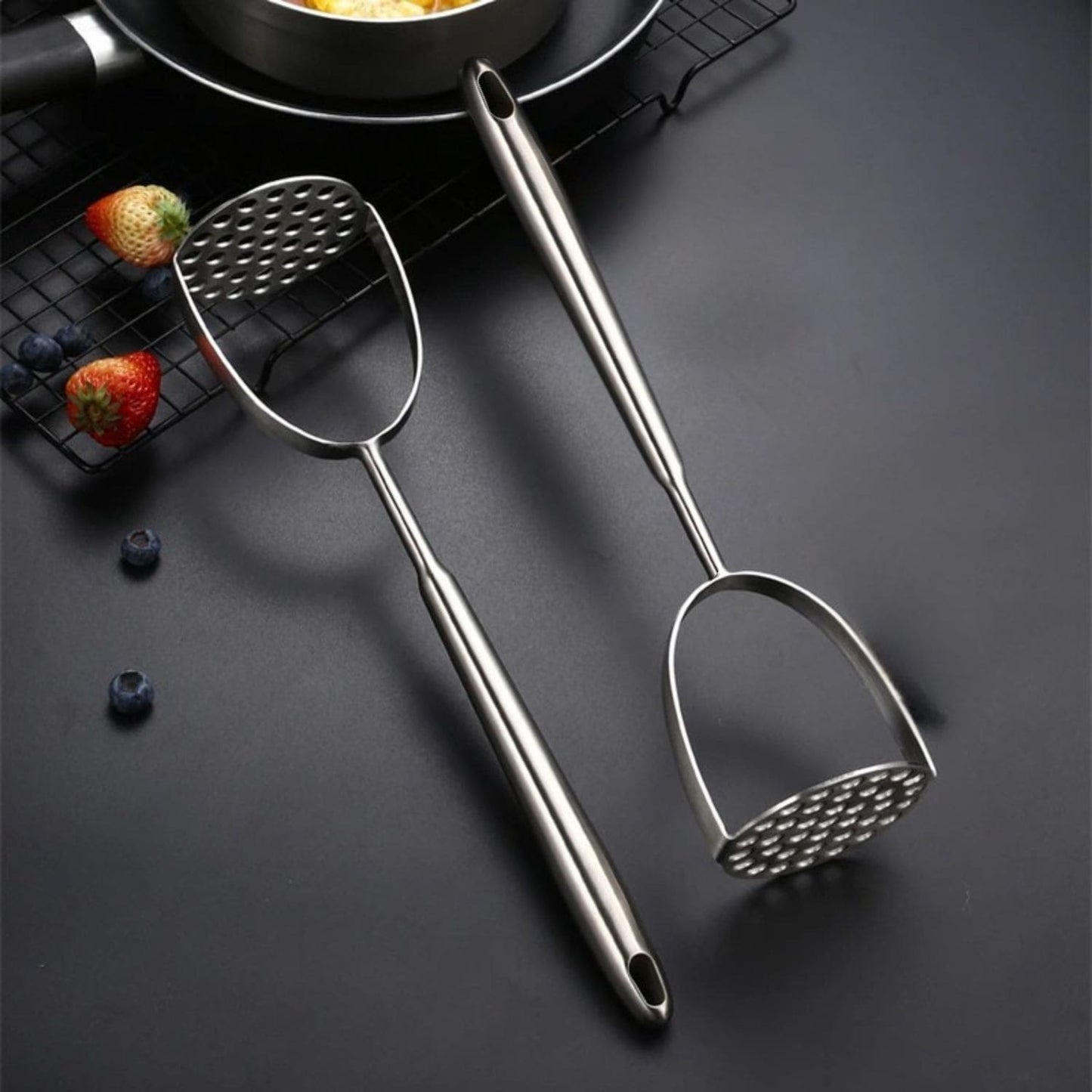 Ergonomic kitchen tool for mashing potatoes and soft vegetables