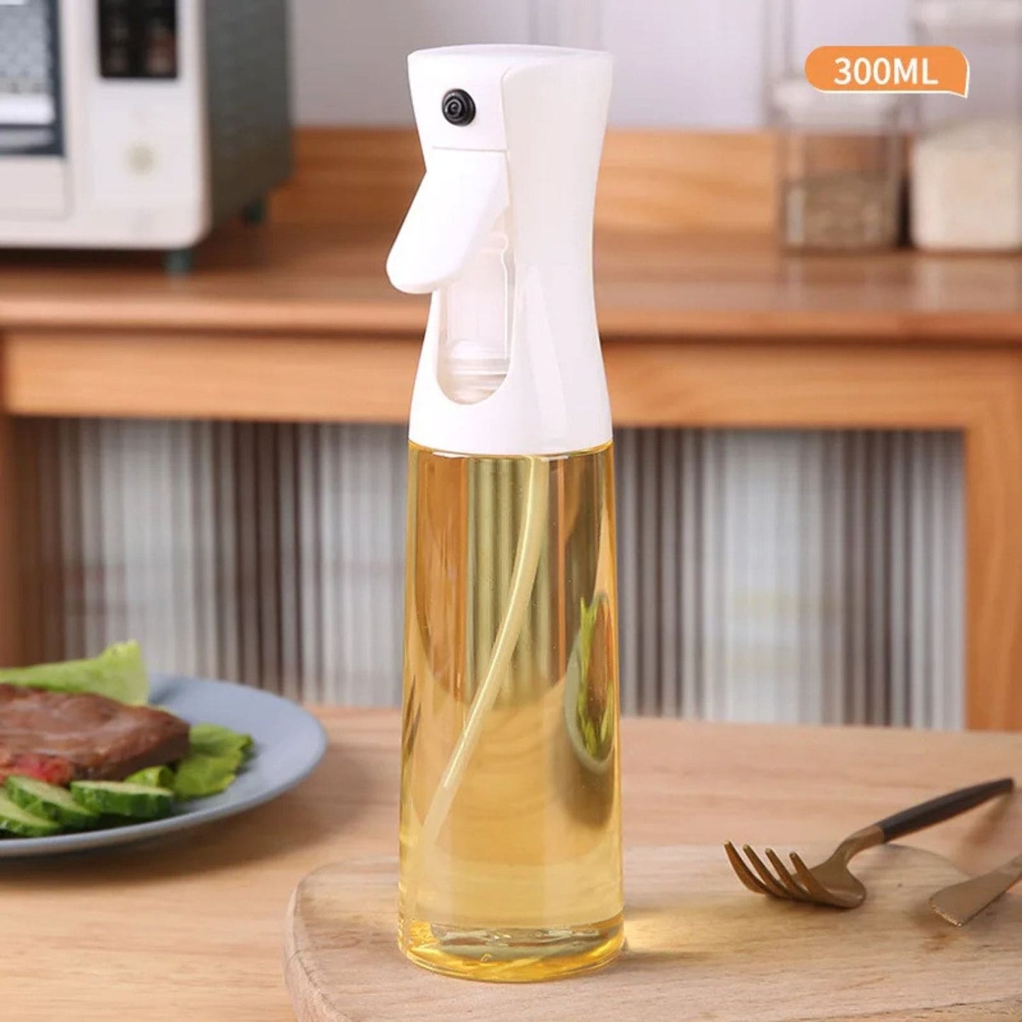 Transparent oil spray bottle with ergonomic trigger and modern design