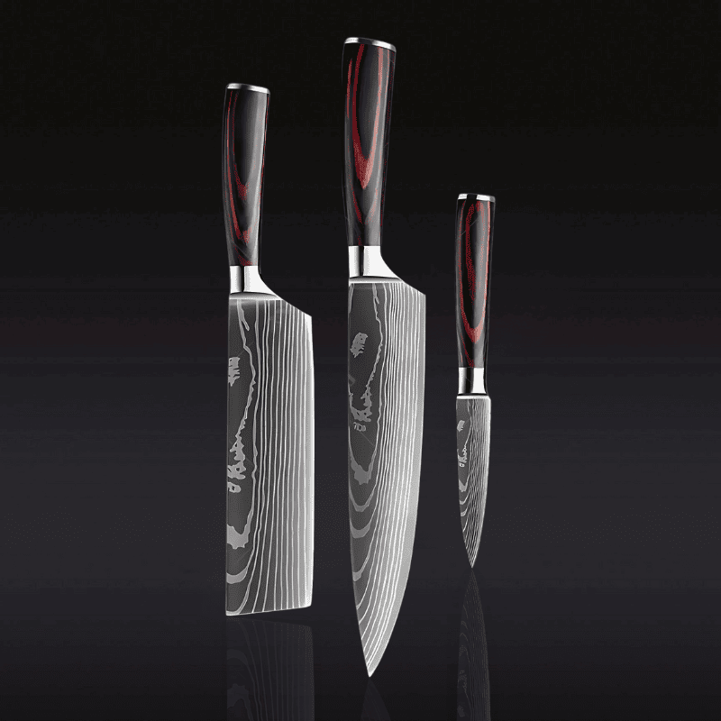 Three knives with Damascus steel blades and wooden handles on a black background