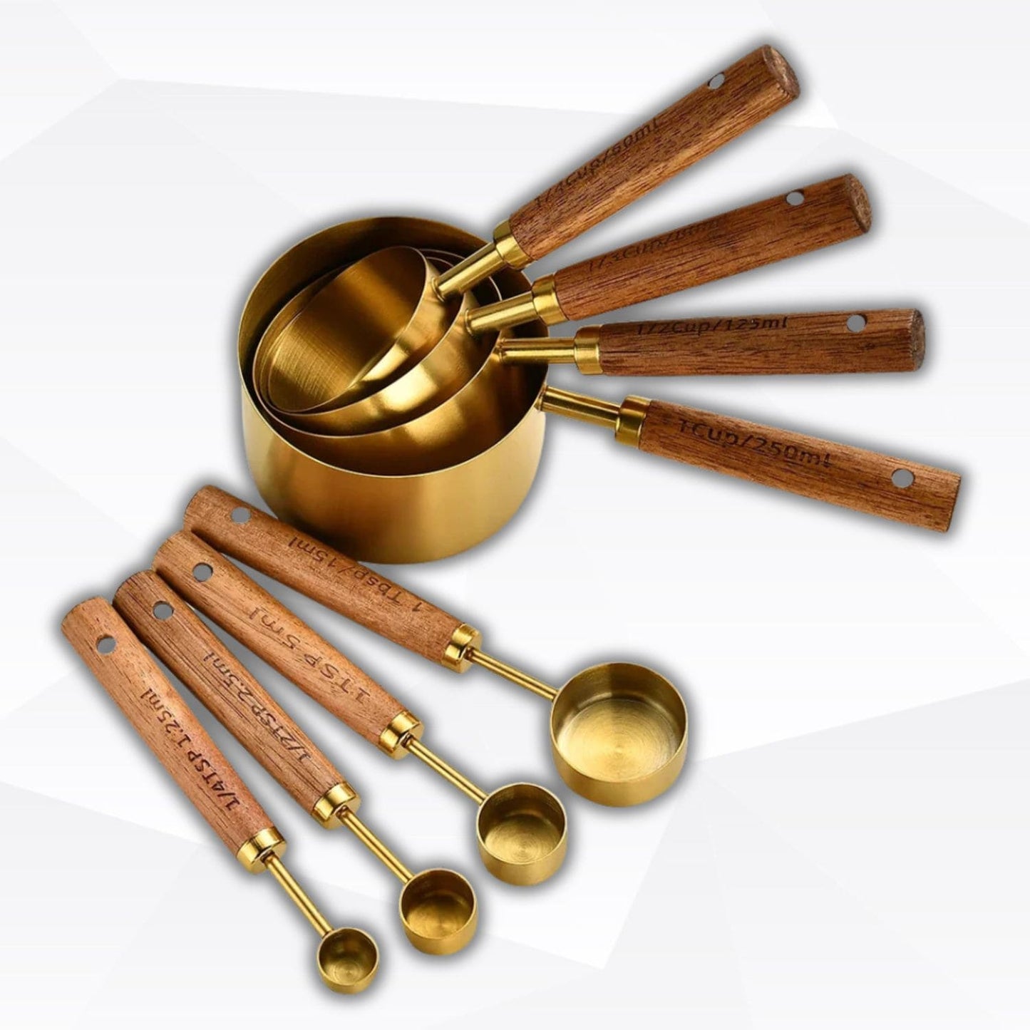 Gold measuring cup and spoon set with wood handles for precise baking