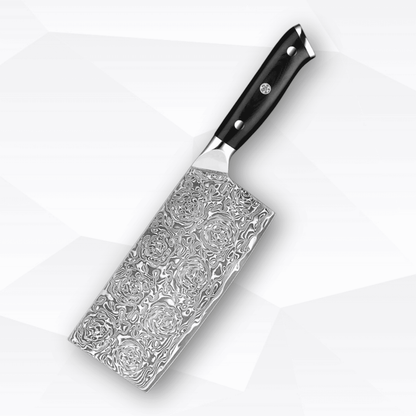 Decorative knife with ornate blade design on a white background