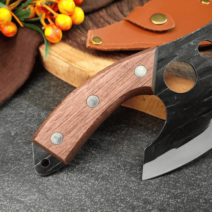 Knife with wooden handle and leather sheath on a dark surface