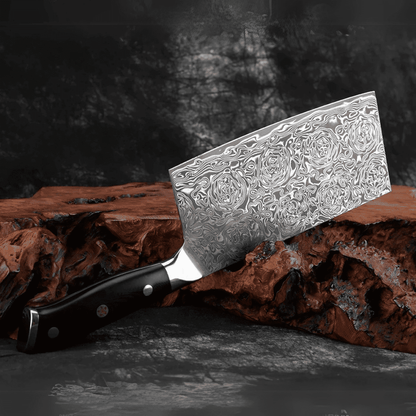 Decorative chef's knife with an embossed blade on a wooden block against a dark background