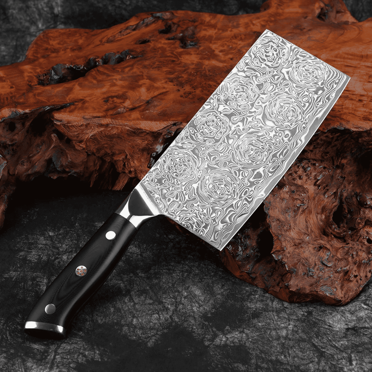 Decorative chef's knife with a patterned blade on a dark surface