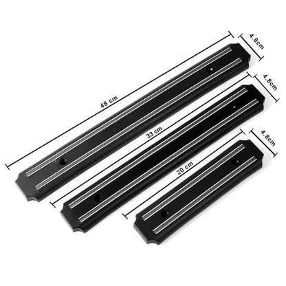 Wall-mounted magnetic knife holder with sharp blades neatly organized