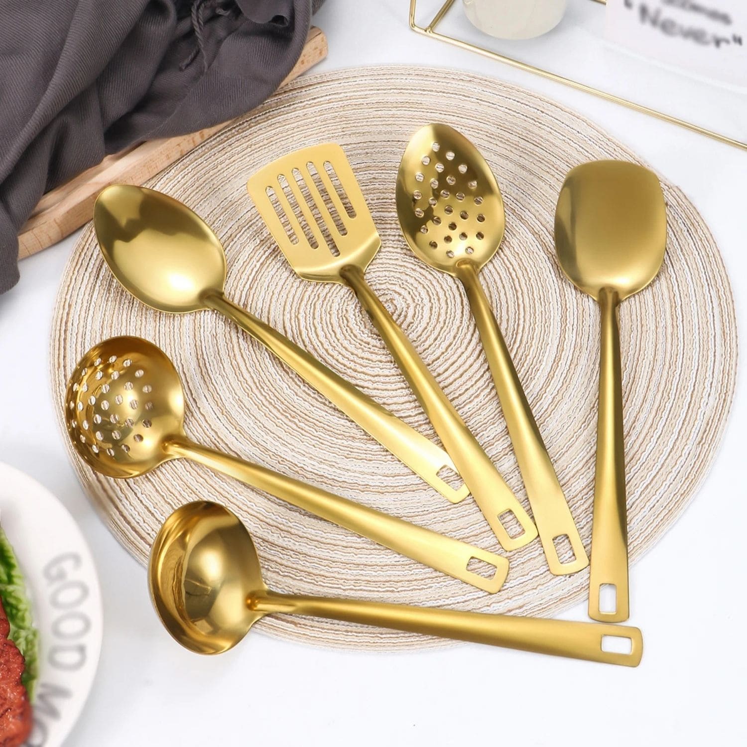 Six-piece golden stainless steel utensil set with ergonomic handles