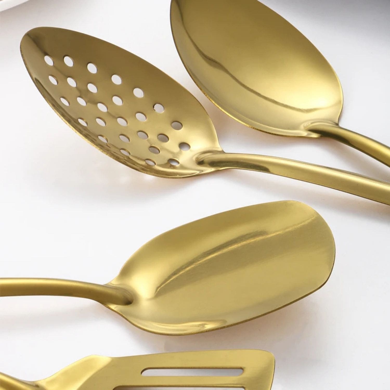 Six-piece golden stainless steel utensil set with ergonomic handles