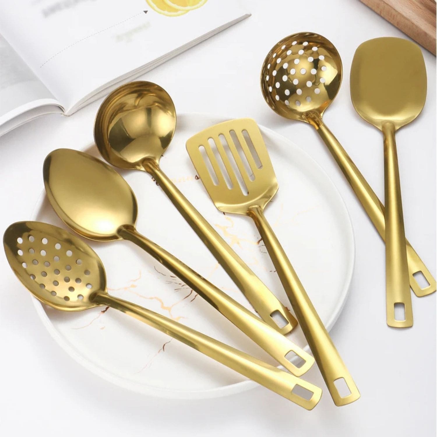 Six-piece golden stainless steel utensil set with ergonomic handles