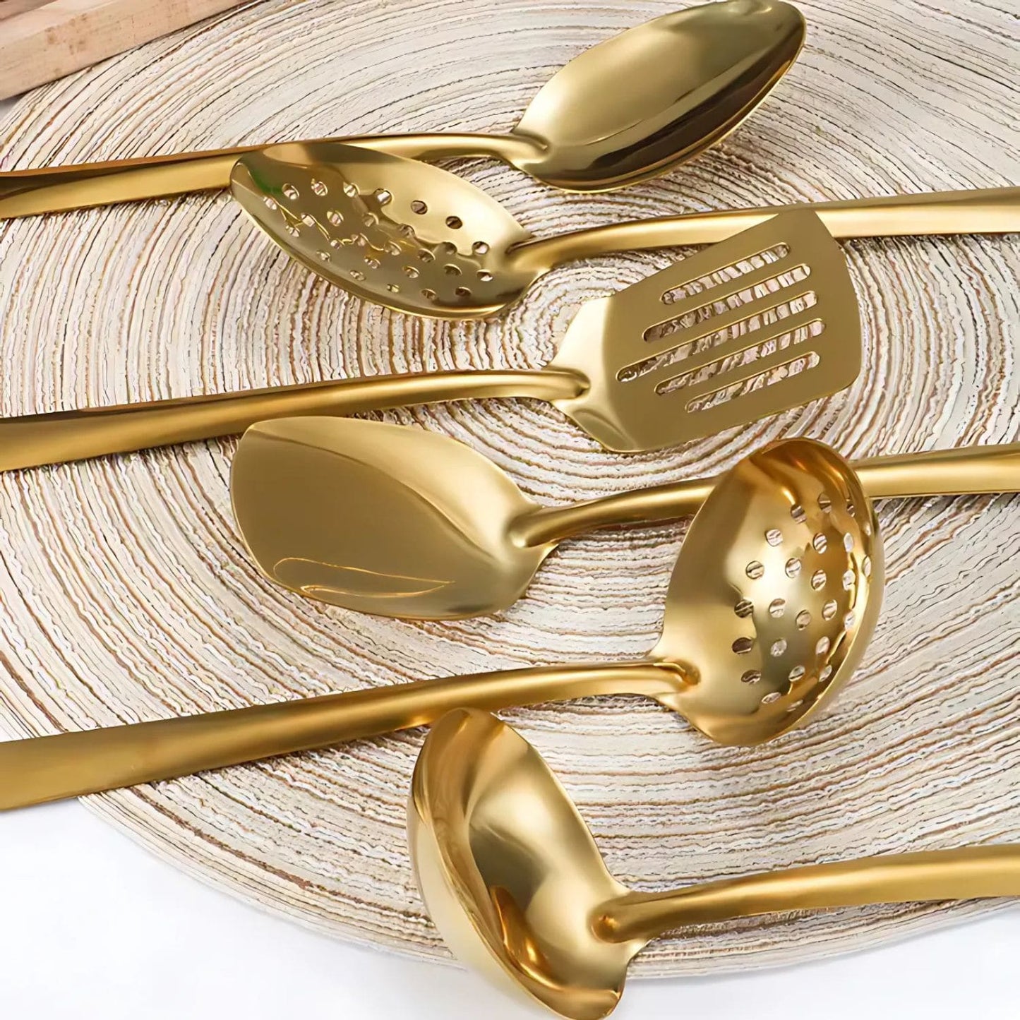 Six-piece golden stainless steel utensil set with ergonomic handles