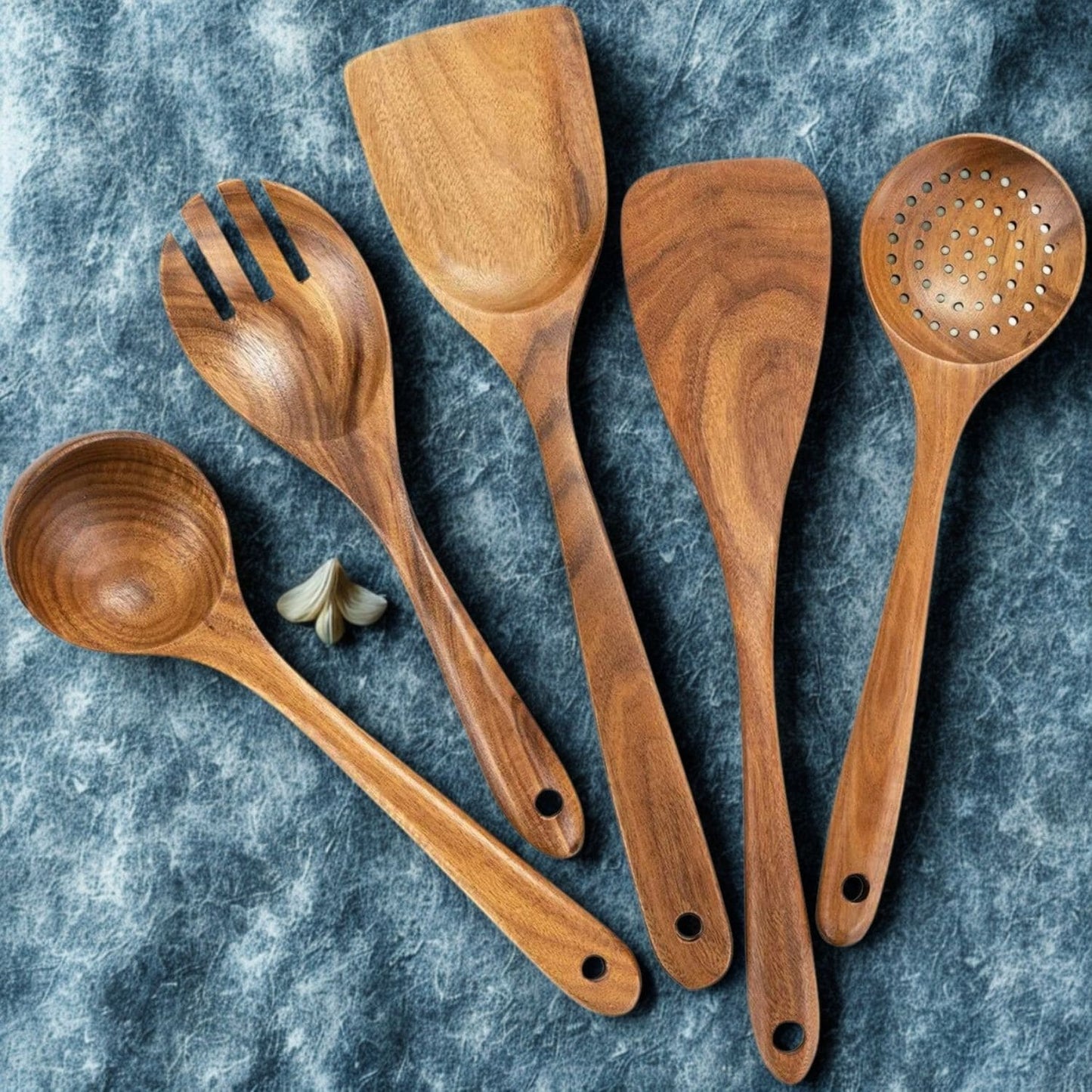 Eco-friendly wood utensil set displayed on a modern kitchen countertop