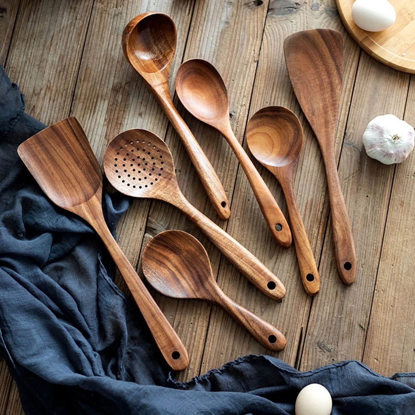 Eco-friendly wood utensil set displayed on a modern kitchen countertop 