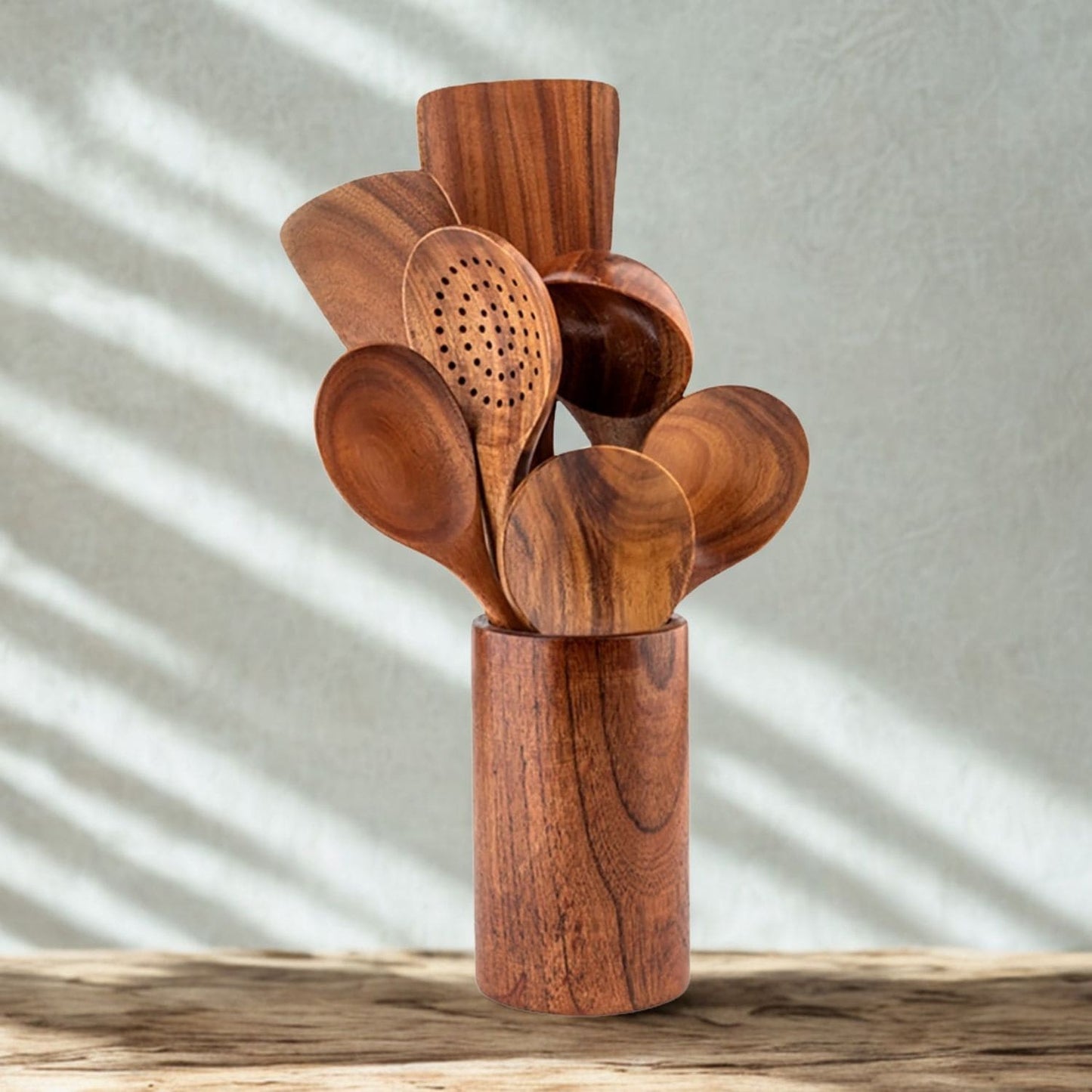 Eco-friendly wood utensil set displayed on a modern kitchen countertop