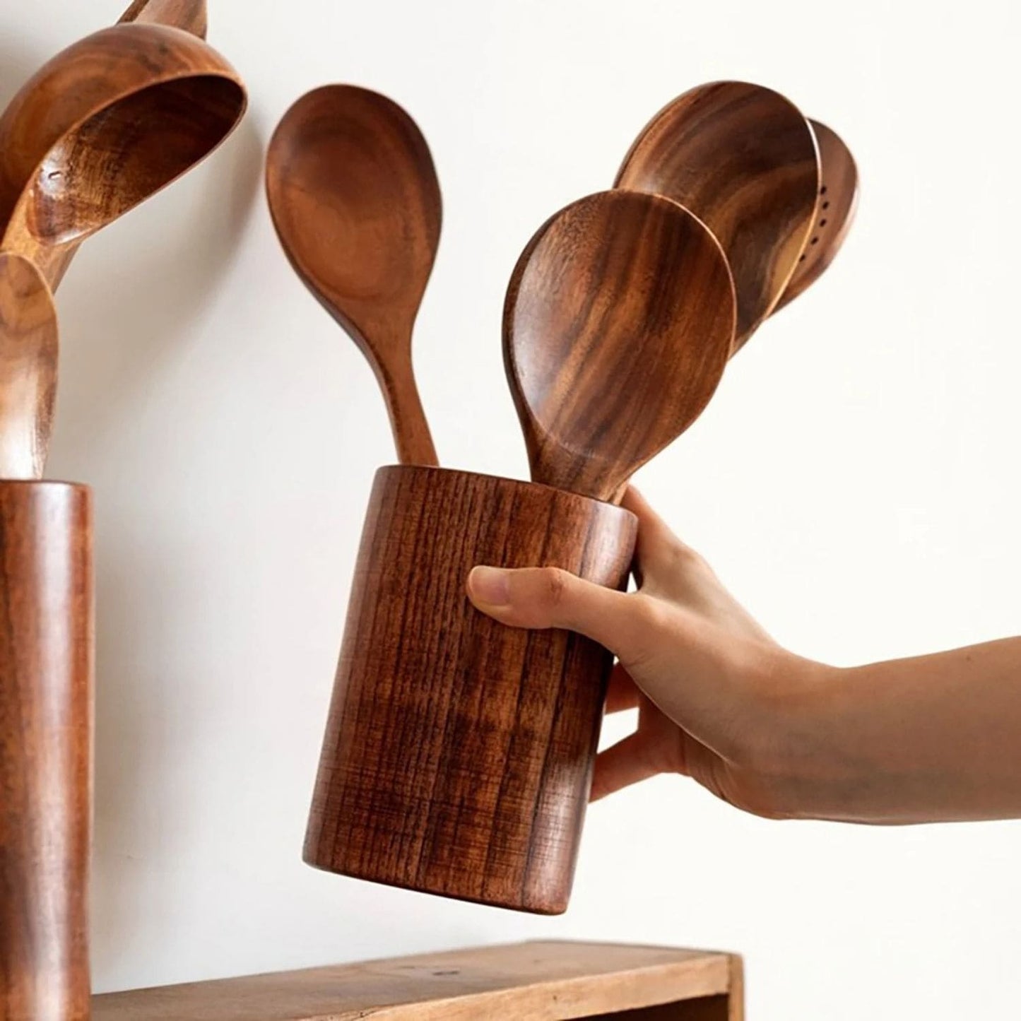 Eco-friendly wood utensil set displayed on a modern kitchen countertop