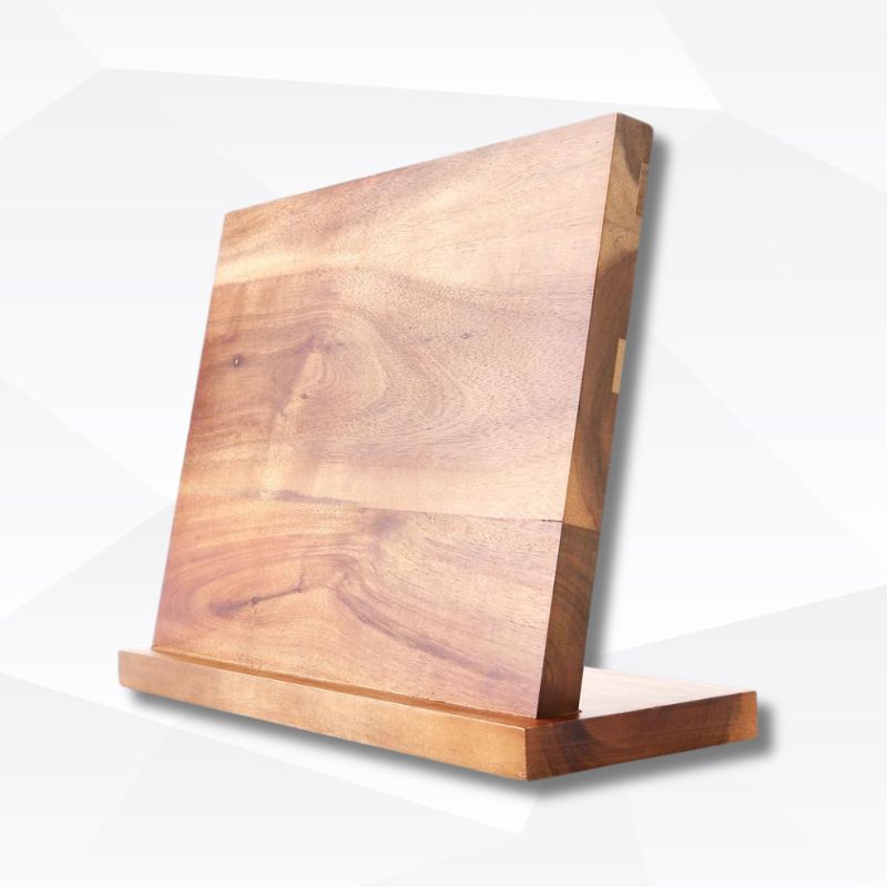 A wooden magnetic knife holder with a sleek design, mounted on a surface.